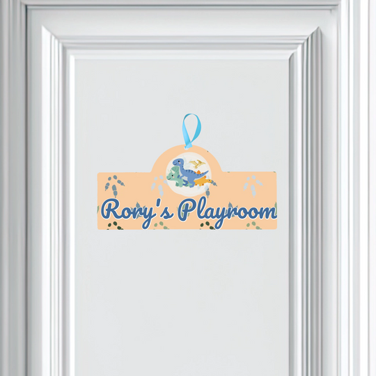 Decorative sign with dinosaur illustration and 'Rory's Playroom' text on a white background