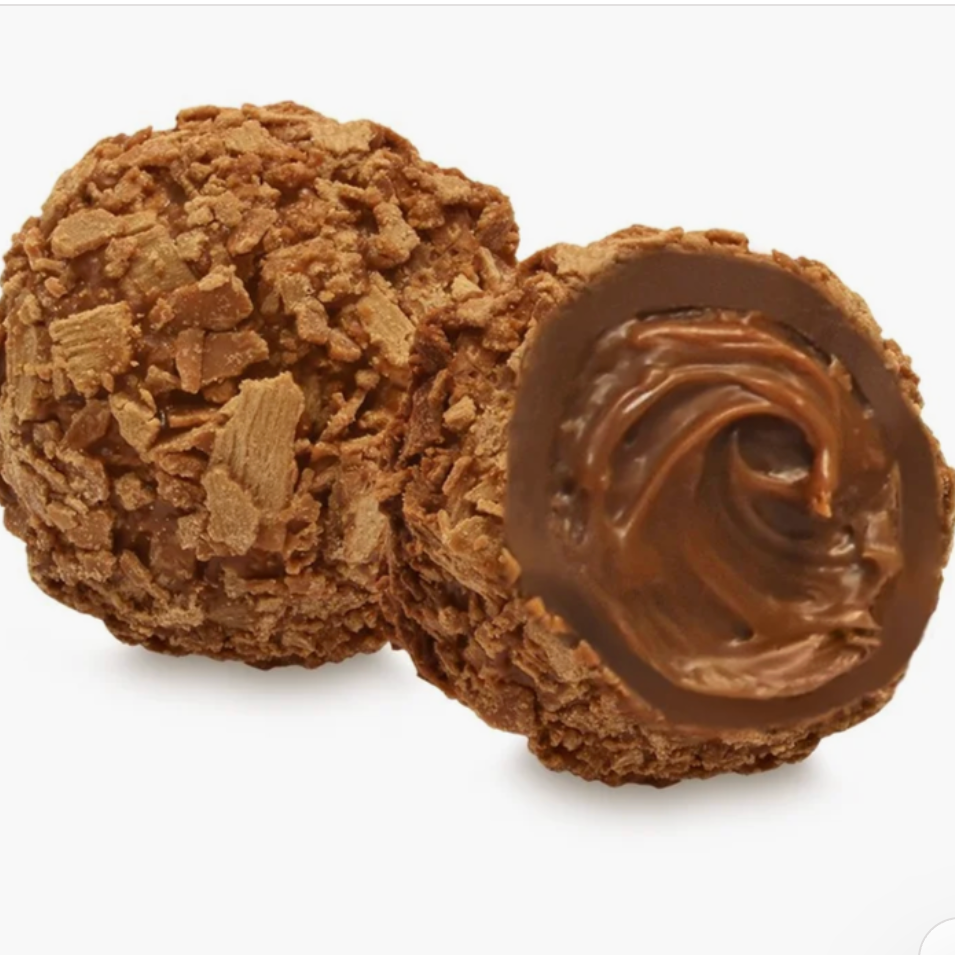 Two chocolate-covered cookie truffles on a white background, with one cut open to show a swirl of chocolate filling.