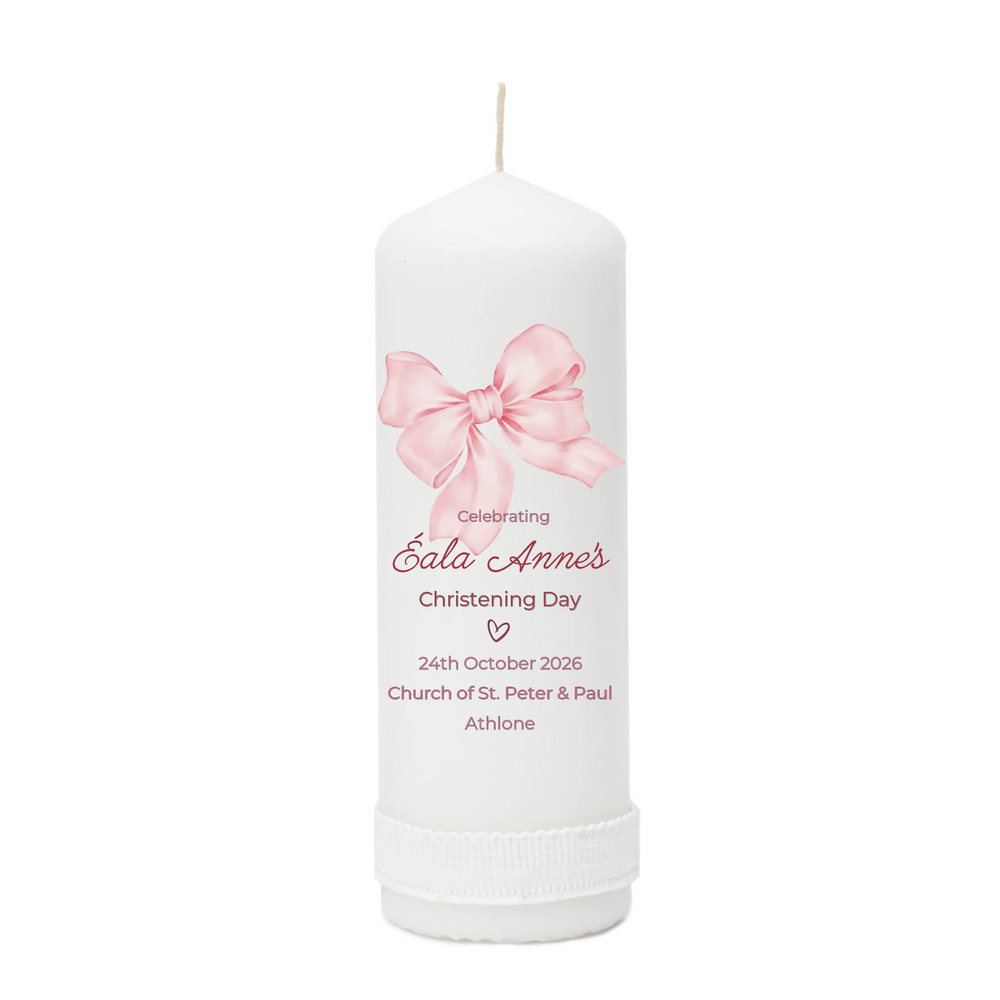 White candle with pink bow design and personalized text on a white background