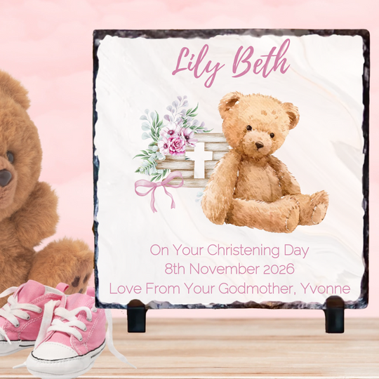 Personalized christening gift with teddy bear, pink shoes, and floral design on a pink background