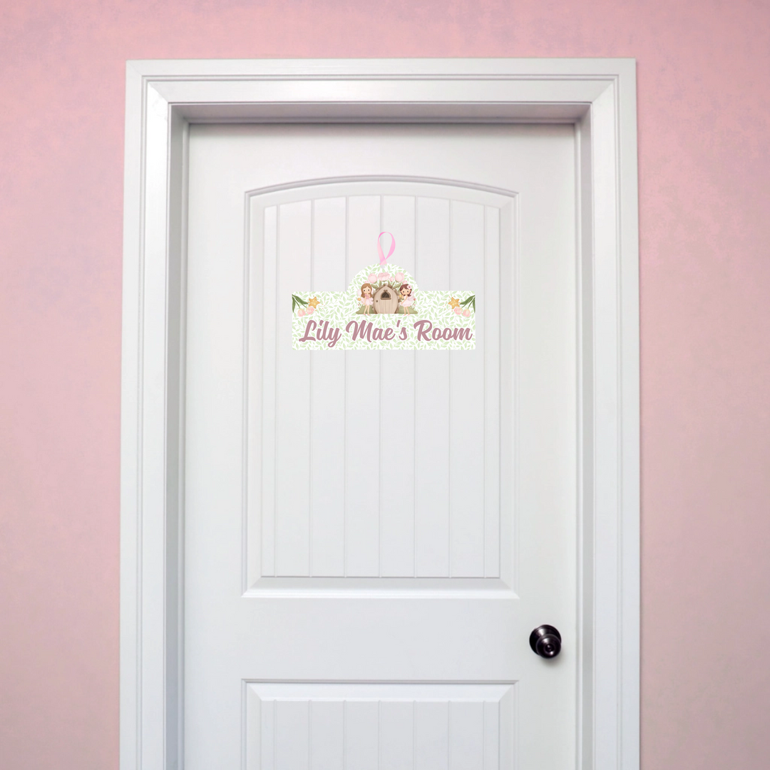 White door with decorative sign on a pink wall