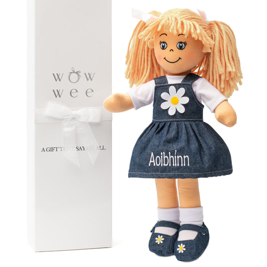 Personalised-Rag-Doll doll with blonde hair and a denim dress featuring a daisy, next to a 'wow wee' gift box. WowWee Doll