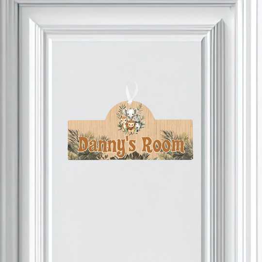 Wooden door hanger with 'Danny's Room' text on a white door