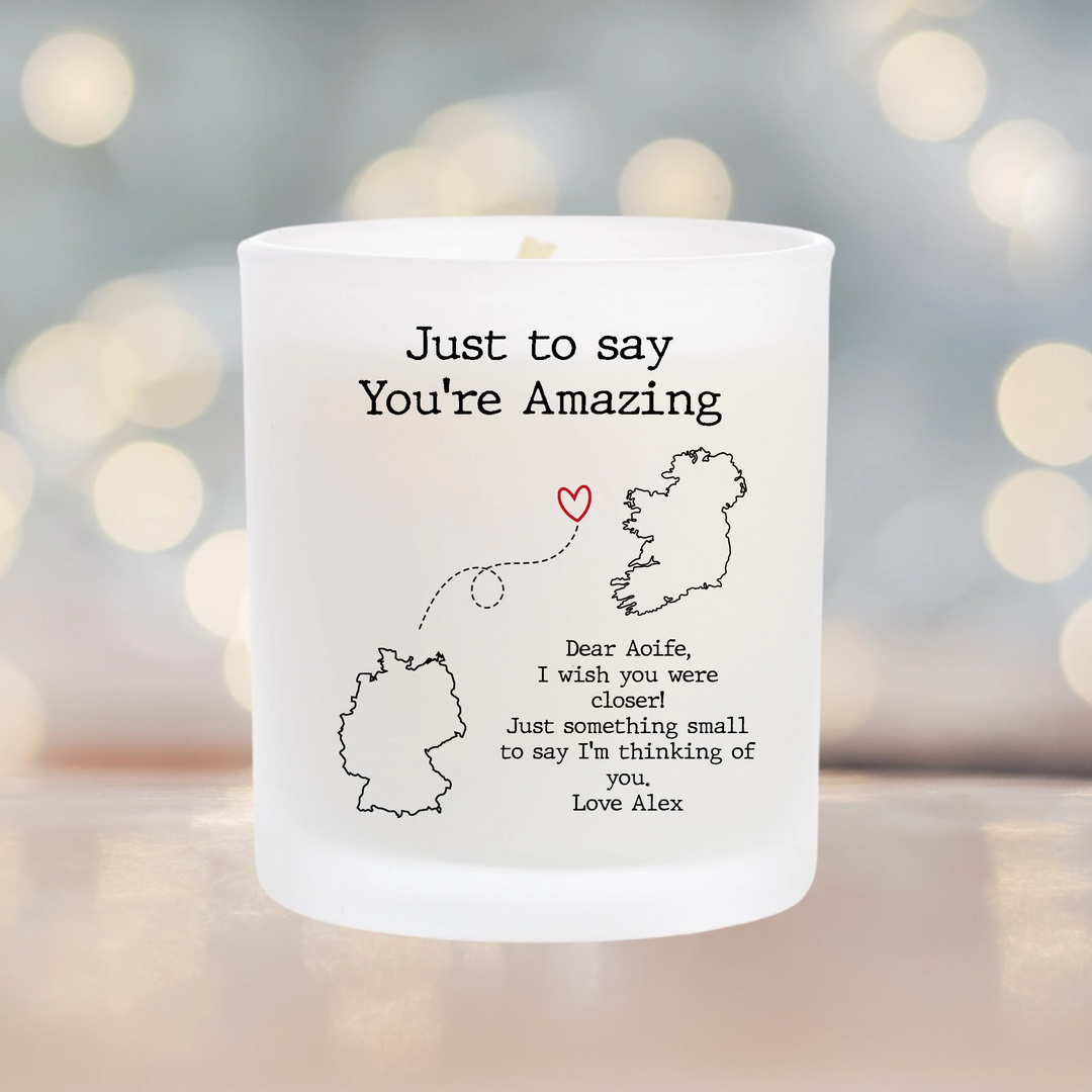 Personalised Scented candle with a personalised sticker. Choose two country maps and add a personal message. a dotted line connects the two countries
