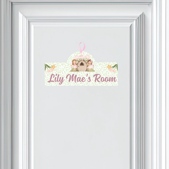Personalized children's room sign with a cartoon character and floral design on a white background.