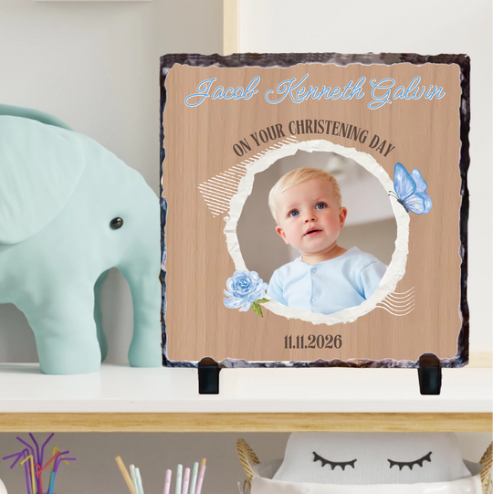 Personalized christening gift with a photo of a baby on a decorative stand.