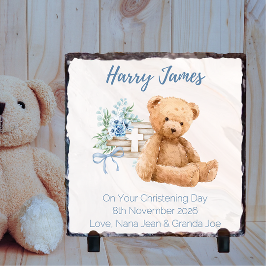 Personalized christening gift with teddy bear and floral design on a wooden background