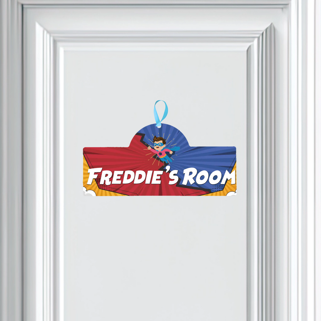 Superhero-themed door sign with 'Freddie's Room' text on a white background