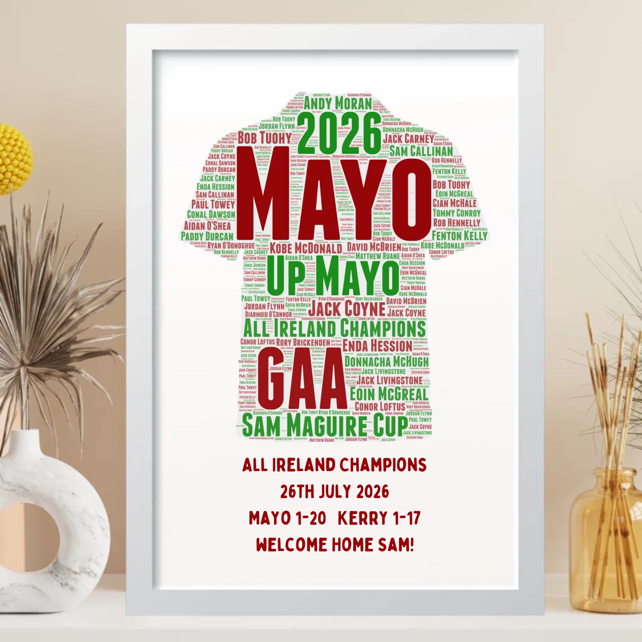 A framed personalized sports poster featuring a GAA player silhouette filled with match-winning phrases and names in green and red text, displayed on a shelf with decorative objects.