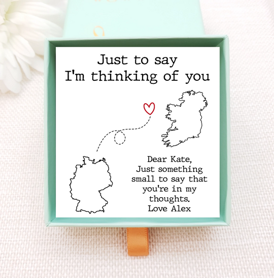 jewellery box insert with necklace. the insert has images of two different countries that are connected by a line. personalise with own image