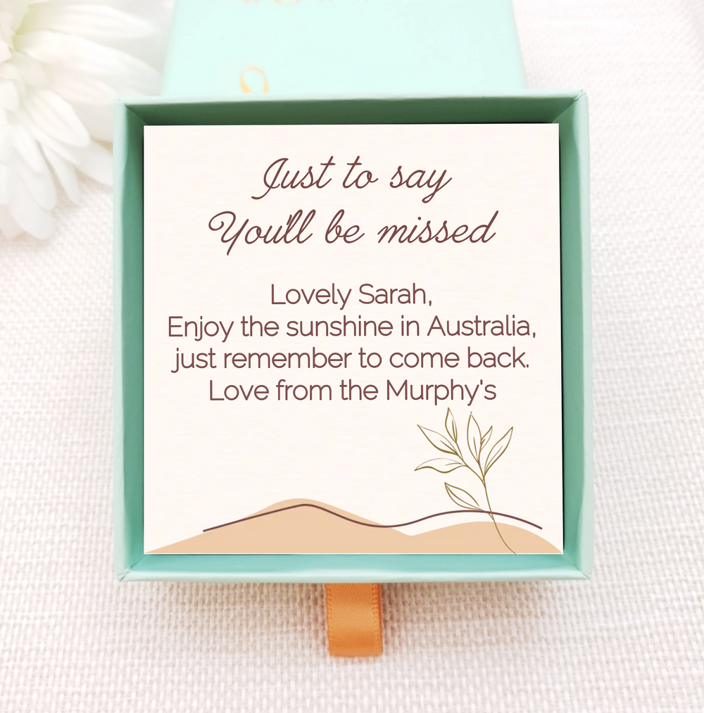 Personalised jewellery box insert with gold necklace. insert is cream with simple leaves and dunes. personalised with own message