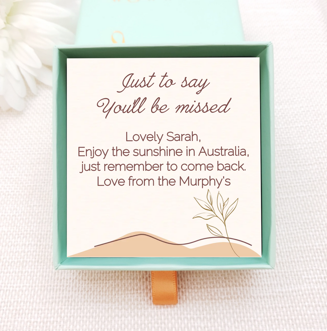 Personalised jewellery box insert with gold necklace. insert is cream with simple leaves and dunes. personalised with own message