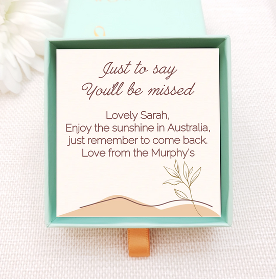 Personalised jewellery box insert with gold necklace. insert is cream with simple leaves and dunes. personalised with own message
