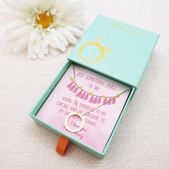 personalised jewellery box insert with gold necklace. the insert is light pink with pink bunting. add own message