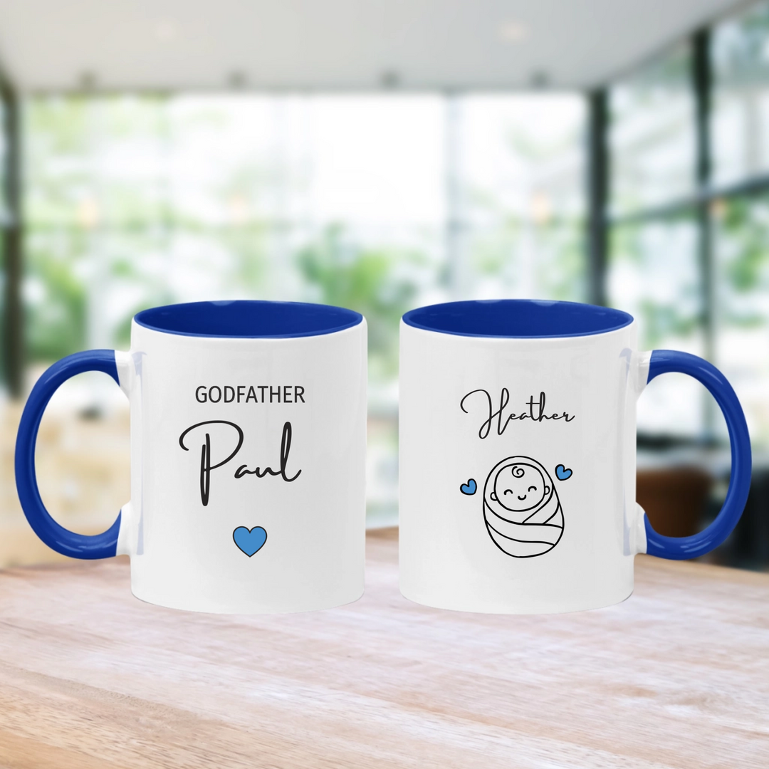 White mug with navy handle that has godfather and their name. also has baby name and image of a baby