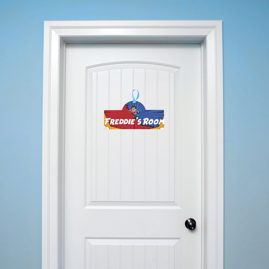 Door with a colorful decal labeled 'Freddie's Room' on a blue wall.