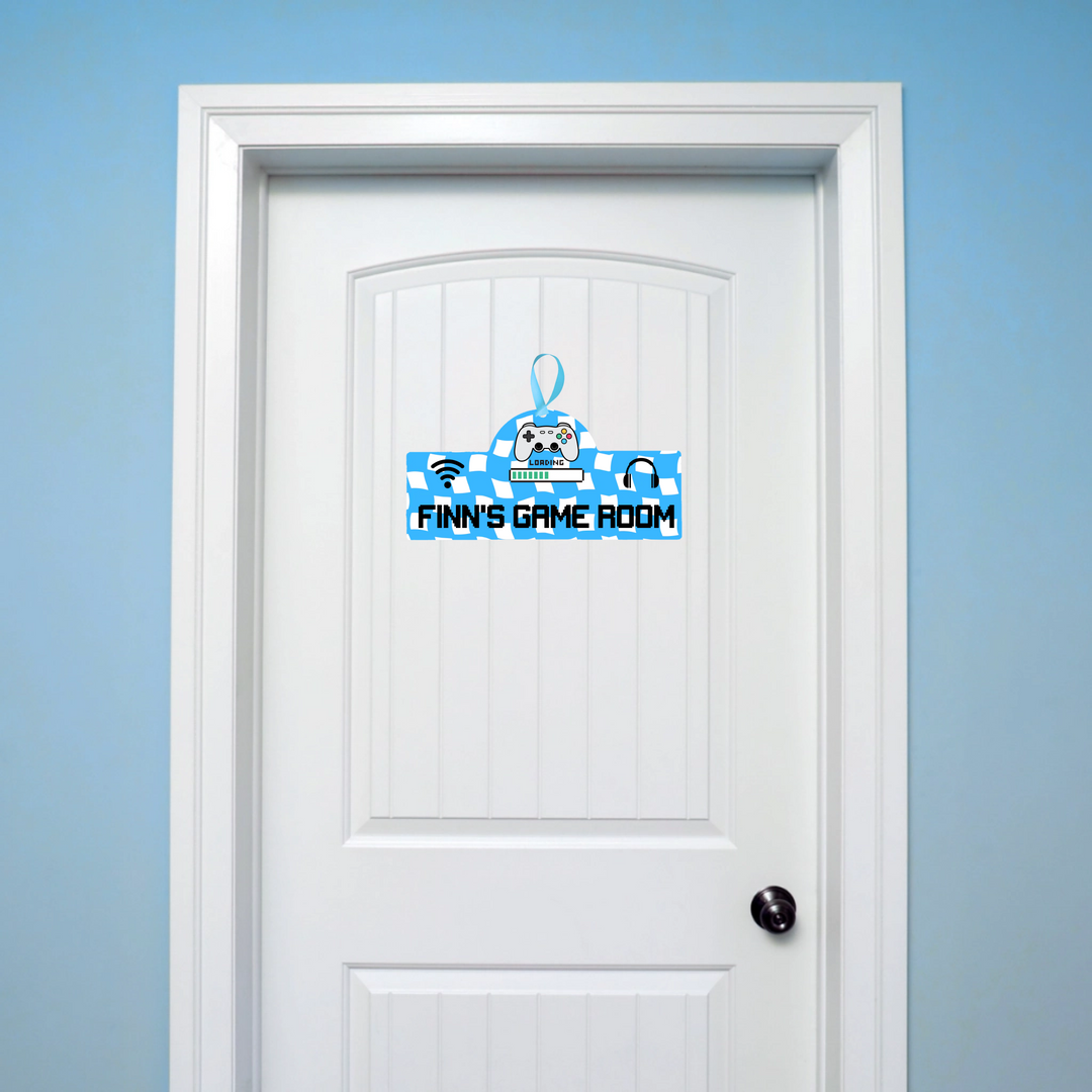 White door with a blue and white decorative decal on a light blue wall