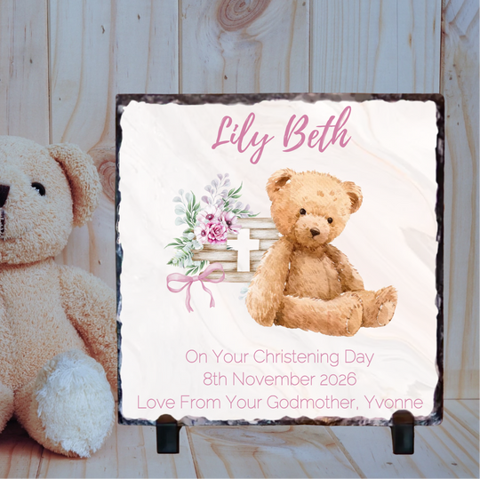Personalized christening gift with teddy bear and floral design on a wooden background