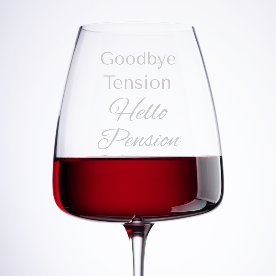Wine glass with red wine and 'Goodbye Tension Hello Pension' text on a white background