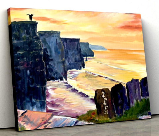A canvas print featuring a vibrant painting of Cliffs of Moher at sunset, with a silhouette of a person on top of the cliffs.
