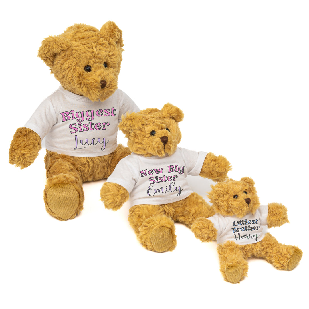 Three teddy bears with t-shirts that are personalised for 3 siblings